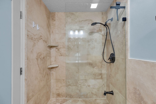 full bath featuring tiled shower