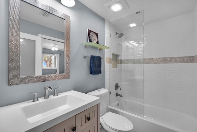 bathroom featuring vanity, toilet, shower / bathtub combination, and ceiling fan