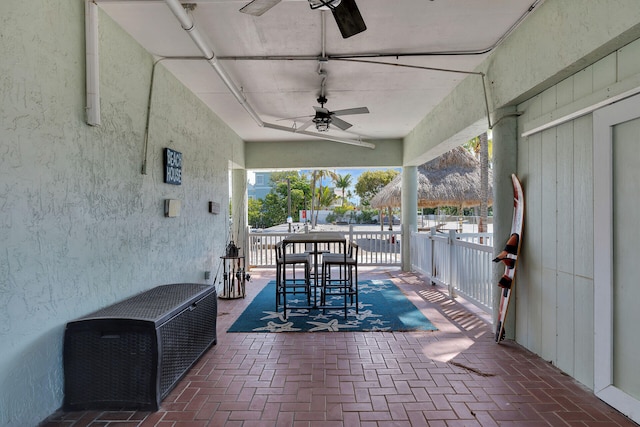 view of patio featuring ceiling fan