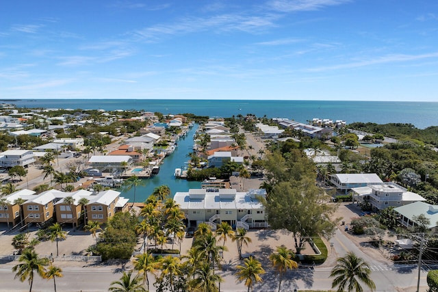 drone / aerial view with a residential view and a water view