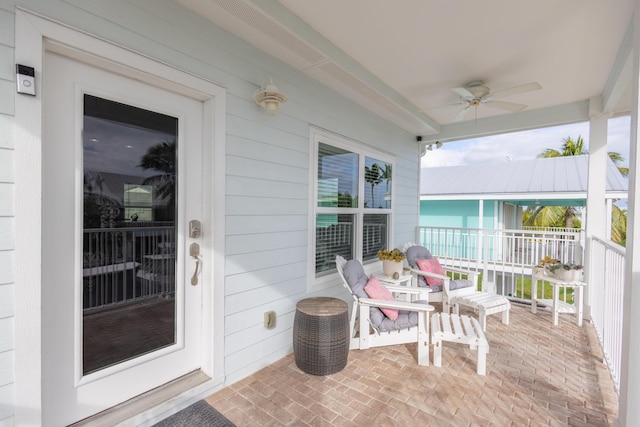 exterior space featuring ceiling fan