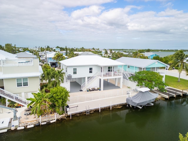 back of house with a water view