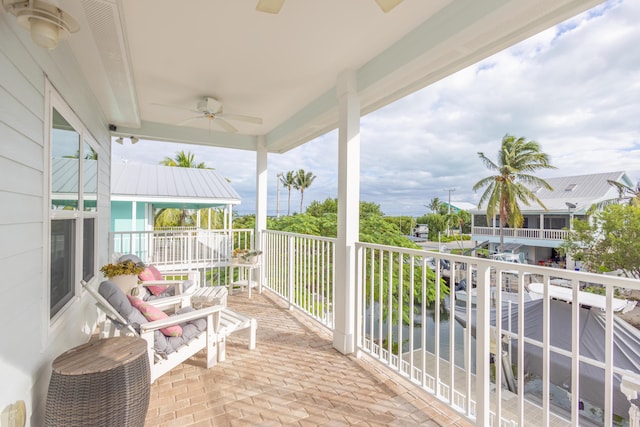 balcony featuring ceiling fan