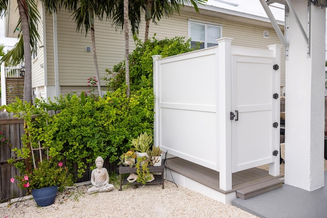 view of home's exterior with a storage shed