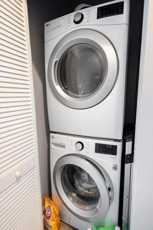 washroom with stacked washer and clothes dryer