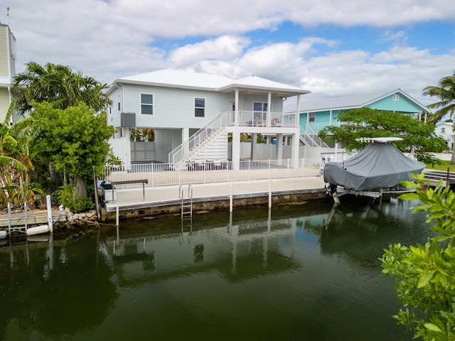 back of house featuring a water view