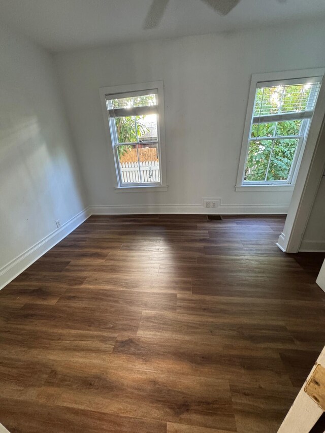 1210 Virginia St, Key West, FL 33040 - empty room featuring dark wood-style floors, baseboards, and a ceiling fan