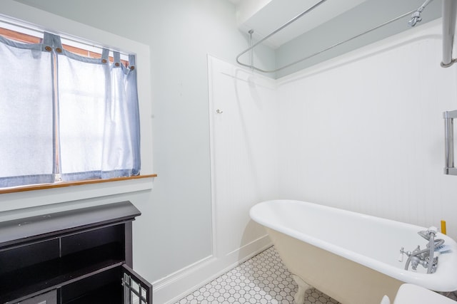 1210 Virginia St, Key West, FL 33040 - bathroom with a freestanding bath, baseboards, and a shower