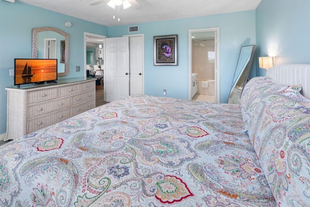 bedroom with ensuite bathroom, a textured ceiling, and ceiling fan