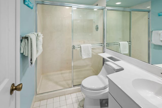 bathroom featuring walk in shower, tile patterned floors, toilet, and vanity