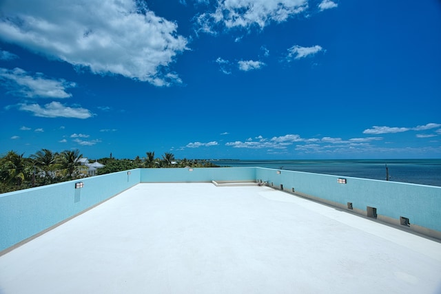 view of patio with a water view