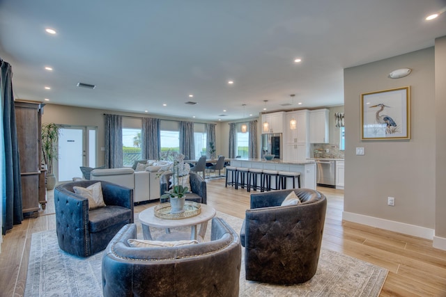 living room with light hardwood / wood-style flooring