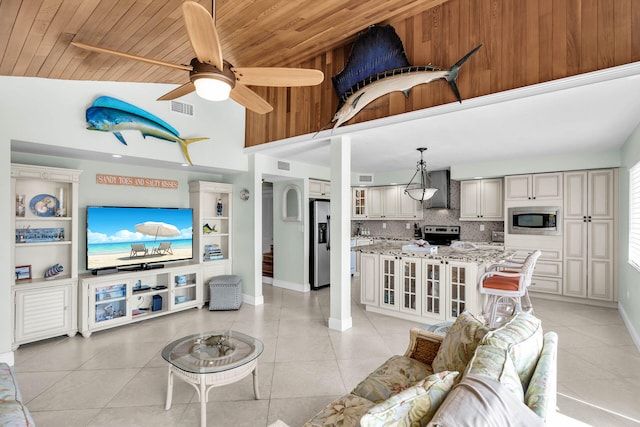 living room featuring light tile patterned flooring, ceiling fan, lofted ceiling, and wooden ceiling