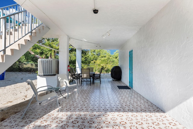 view of patio featuring central air condition unit