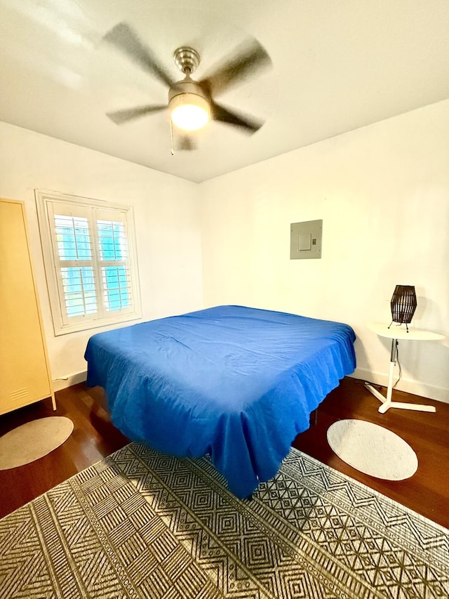 804 S St Unit 1, Key West, FL 33040 - bedroom featuring wood finished floors, baseboards, electric panel, and ceiling fan