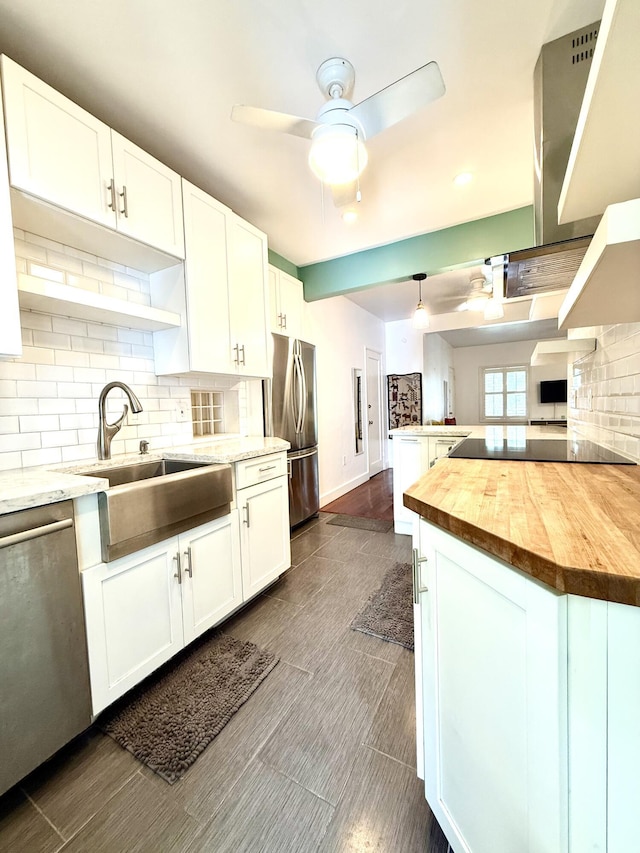 804 S St Unit 1, Key West, FL 33040 - kitchen featuring appliances with stainless steel finishes, butcher block countertops, a sink, backsplash, and recessed lighting