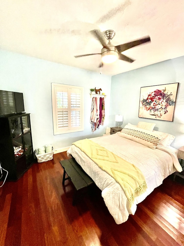 bedroom featuring a ceiling fan and wood finished floors