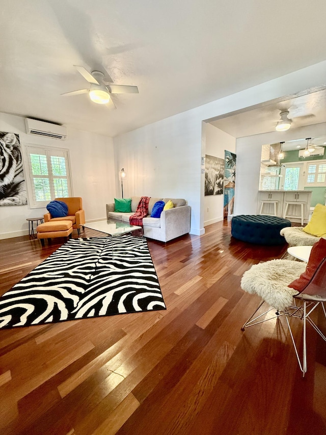804 S St Unit 1, Key West, FL 33040 - living room featuring an AC wall unit, a ceiling fan, wood finished floors, and baseboards