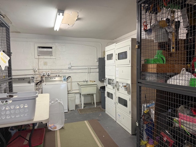 804 S St Unit 1, Key West, FL 33040 - washroom with stacked washer / drying machine, an AC wall unit, and washer and clothes dryer