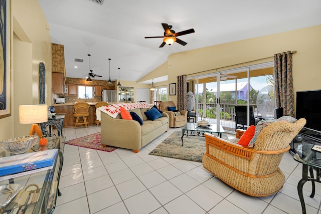 tiled living room featuring ceiling fan and lofted ceiling