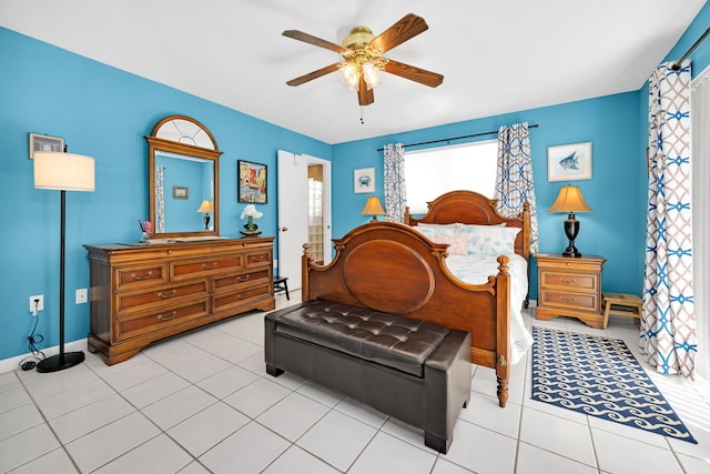 tiled bedroom featuring ceiling fan