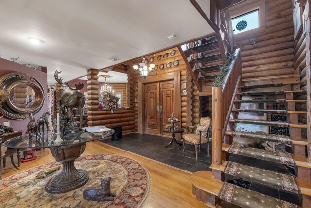 interior space with hardwood / wood-style floors and a chandelier