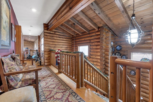 hallway featuring vaulted ceiling with beams, log walls, wooden ceiling, and light wood-type flooring