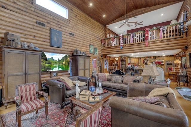 living room featuring ceiling fan, log walls, light wood-type flooring, and wood ceiling