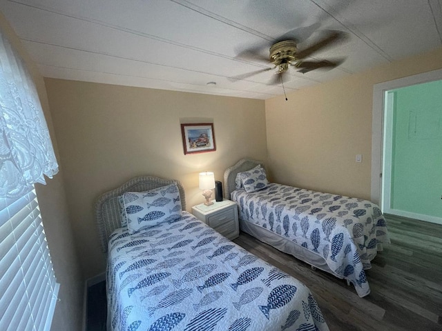 bedroom with wood-type flooring and ceiling fan