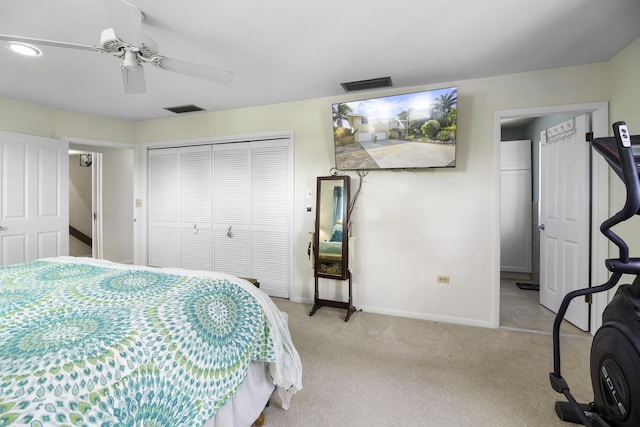 carpeted bedroom with a closet and ceiling fan