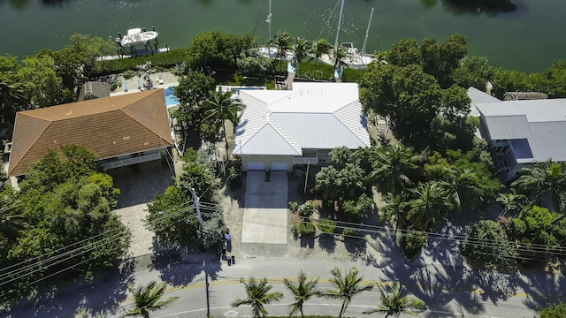 birds eye view of property with a water view