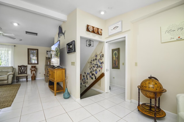 hall with light tile patterned floors