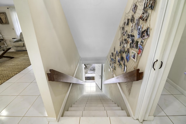 stairway featuring tile patterned floors