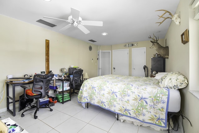 tiled bedroom with ceiling fan