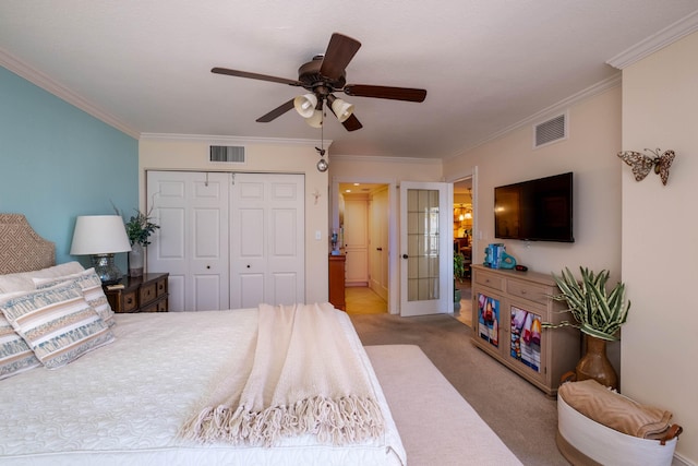 bedroom with light colored carpet, ornamental molding, a closet, and ceiling fan