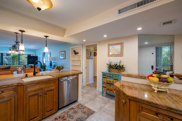 kitchen featuring sink, dishwasher, light stone counters, light tile patterned flooring, and decorative light fixtures