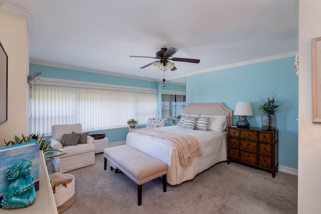 bedroom featuring crown molding, ceiling fan, and light carpet