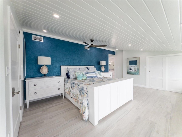 bedroom featuring ceiling fan and light hardwood / wood-style floors