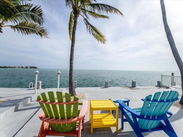 view of patio with a water view