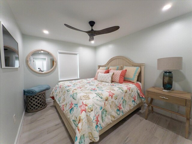 bedroom featuring ceiling fan and light hardwood / wood-style floors