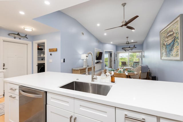 kitchen with sink, white cabinetry, dishwasher, ceiling fan, and washer / clothes dryer