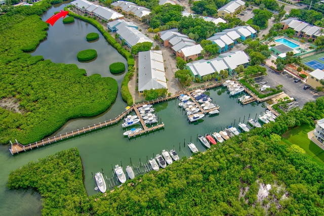 birds eye view of property with a water view