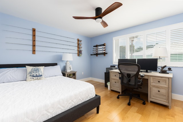 bedroom featuring light wood-type flooring and ceiling fan