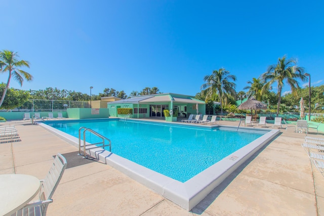 view of swimming pool featuring a patio area