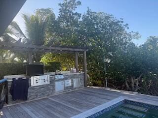 44 S Blackwater Ln, Key Largo, FL 33037 - deck featuring an outdoor kitchen and a jacuzzi