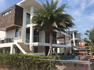 44 S Blackwater Ln, Key Largo, FL 33037 - view of building exterior with a fenced front yard and stairway
