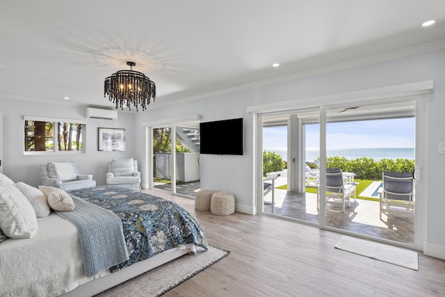 bedroom with crown molding, an inviting chandelier, access to exterior, a wall mounted air conditioner, and wood-type flooring