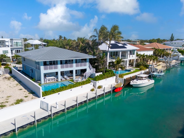 rear view of property featuring a water view