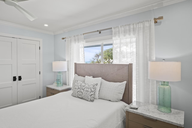 bedroom with ornamental molding and a closet