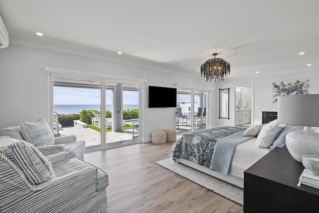 bedroom featuring crown molding, an inviting chandelier, light wood-type flooring, and access to outside